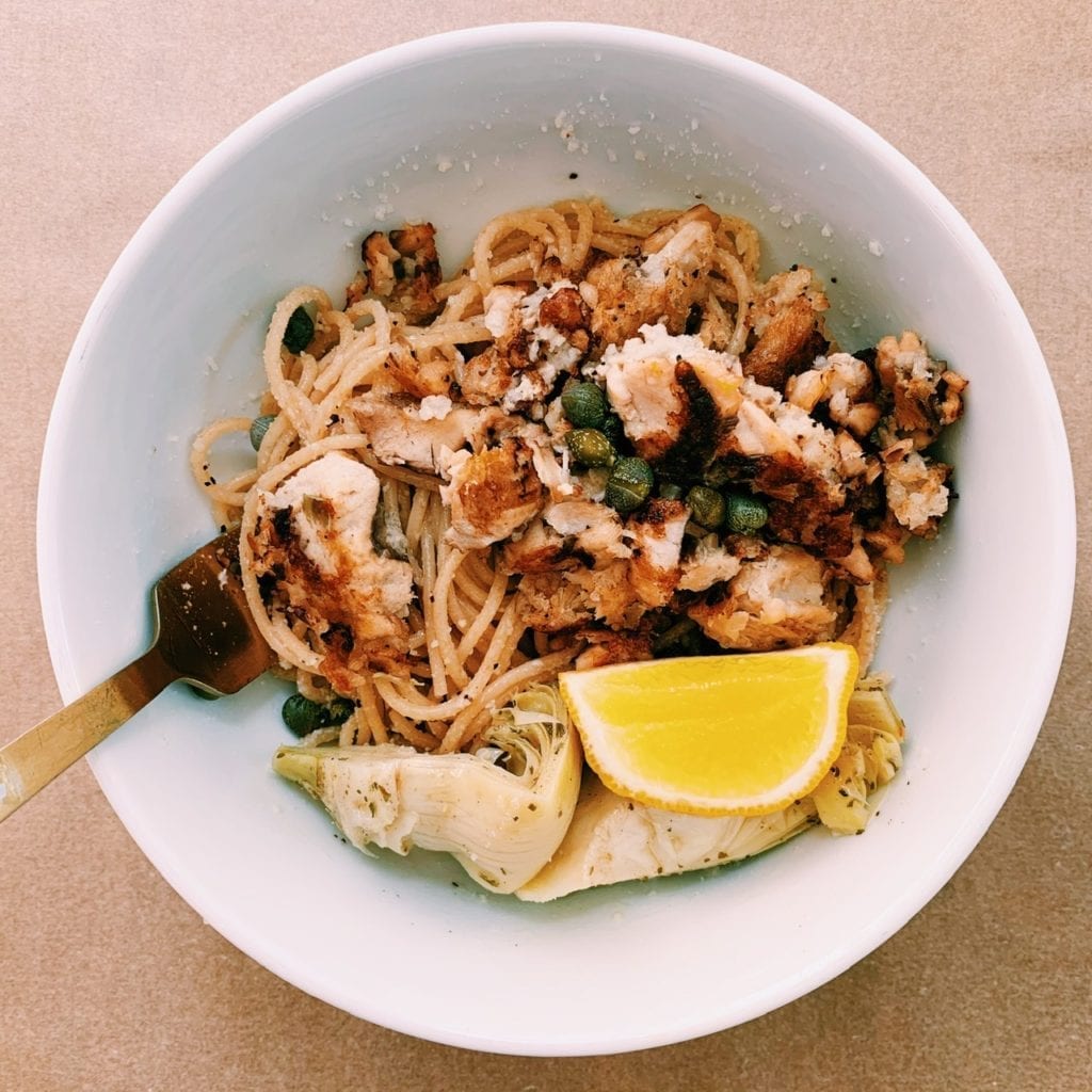 Crispy salmon pasta without cream in a white bowl.