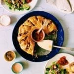Overhead shot of crescent roll taco ring on blue plate