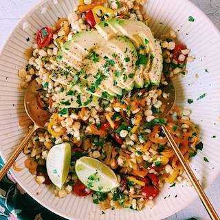 roasted corn salad in a white bowl