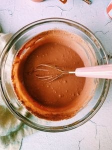 Ingredients for cherry fudge pops mixed in a bowl