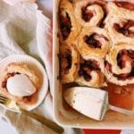 Strawberry rhubarb roly poly in a red baking dish