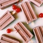 Cherry fudge pops laid out on marble slab