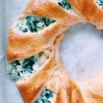 Close up of spinach and artichoke dip crescent ring