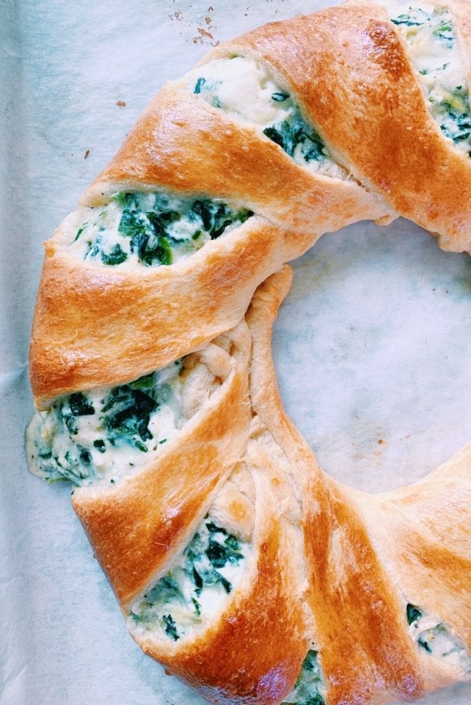 Close up of spinach and artichoke dip crescent ring