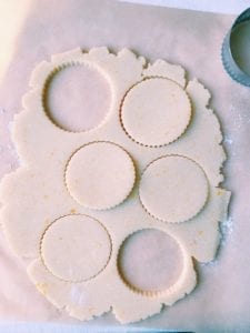 Shortbread dough that’s been cut out with cookie cutters
