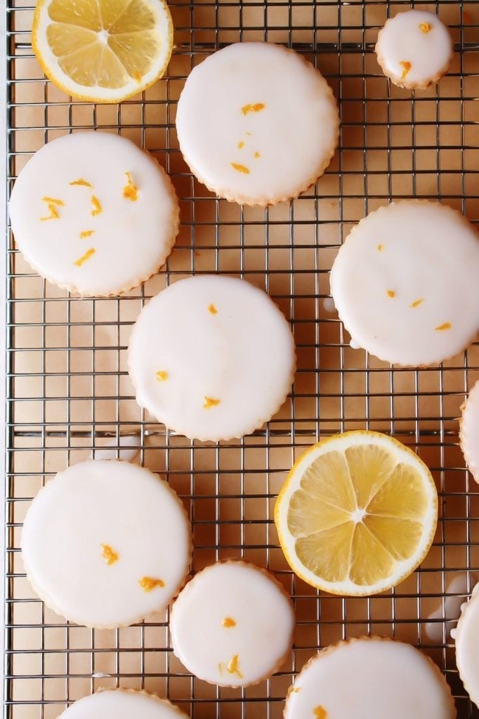 Lemon shortbread cookies with lemon glaze on a cooling rack