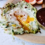 close up a zucchini and eggs on a plate