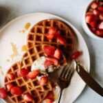 sourdough discard waffles topped with strawberries