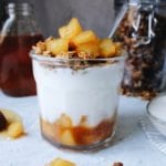 Parfait with pear and honey compote in a glass jar