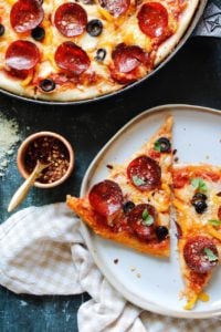 slices on sourdough discard pizza on white plates