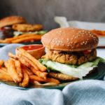 southwest chickpea burger on a bun with french fries