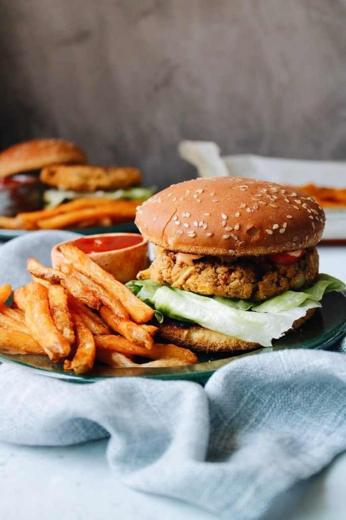 southwest chickpea burger on a bun with french fries