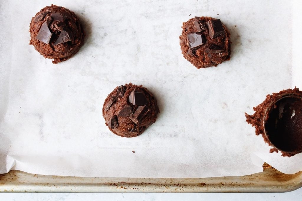 double chocolate cookie dough dropped on a baking sheet