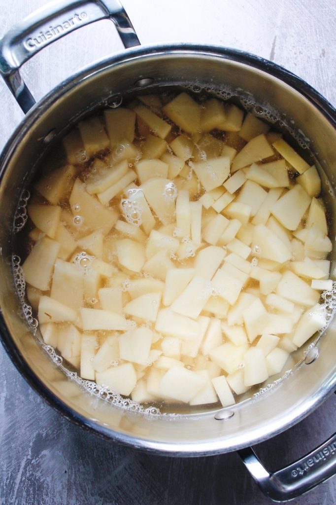 diced russet potatoes in a large pot covered with water