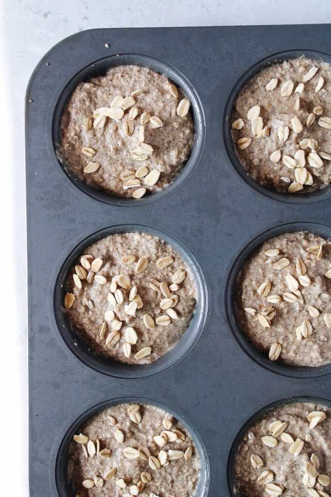 muffin batter topped with oats before being baked