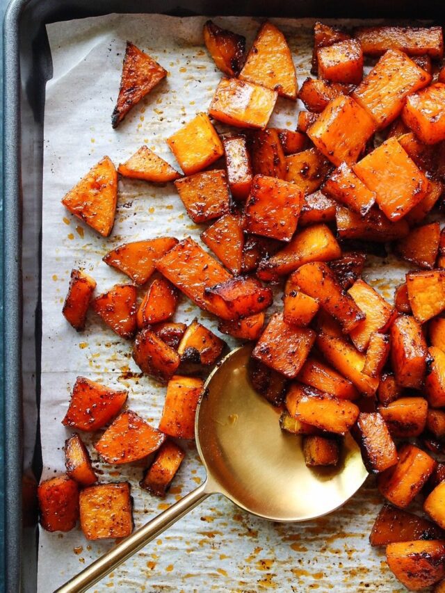 SPICY ROASTED BUTTERNUT SQUASH ON A BAKING SHEET