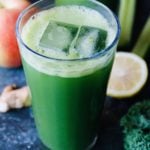 kale apple celery juice in clear glass with ice