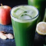 kale apple celery juice in a clear glass