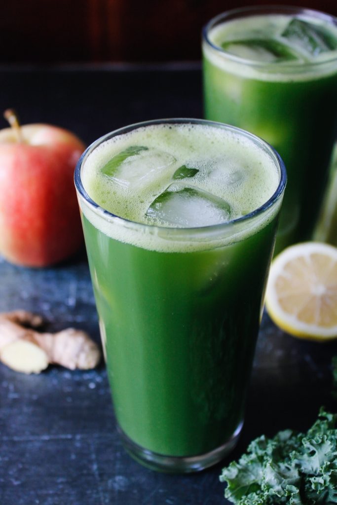 kale apple celery juice in a clear glass