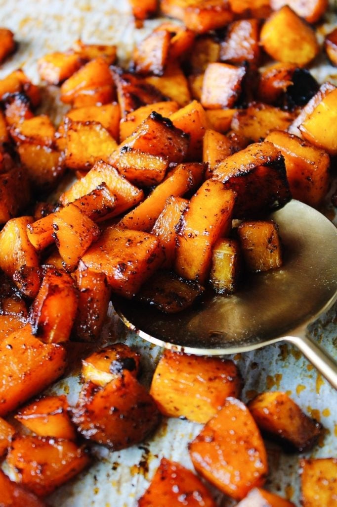 sweet and spicy roasted butternut squash on a baking sheet