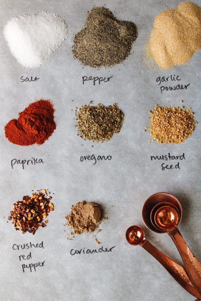 ingredients for trader joes everyday seasoning blend laid out and labeled on a piece of parchment