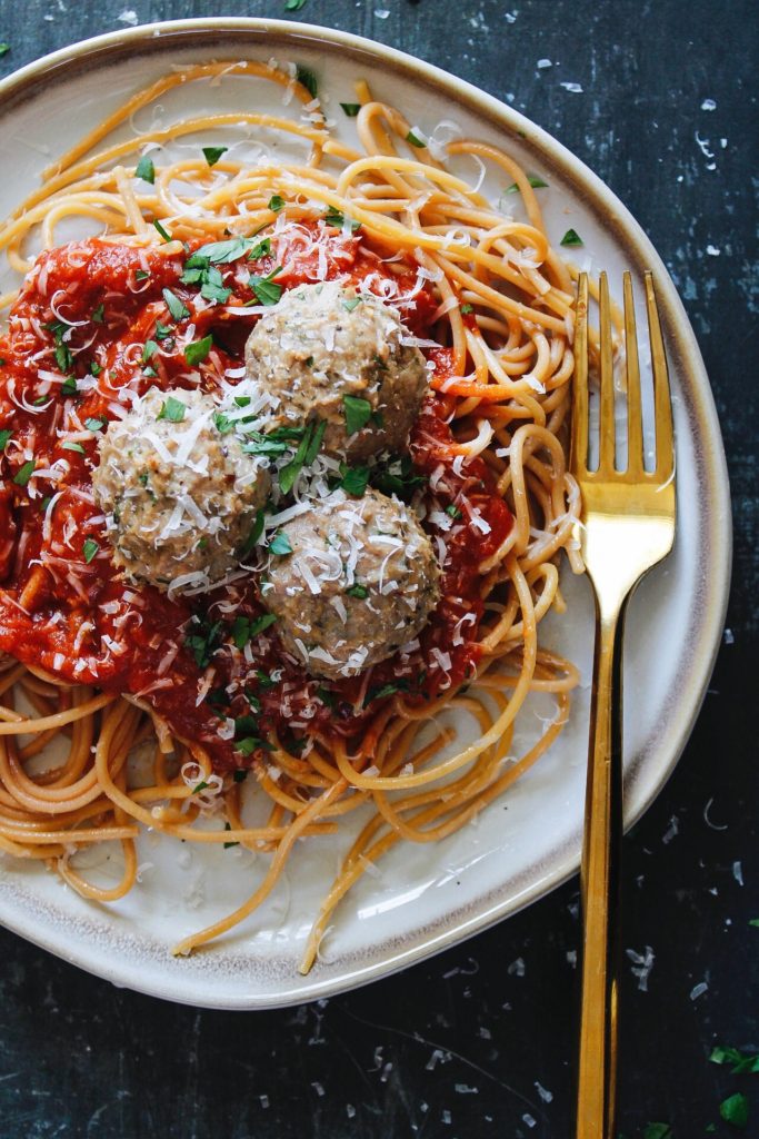 turkey meatballs without breadcrumbs on a plate with spaghetti and marinara