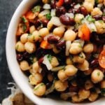 chickpea and black bean salad in a white bowl