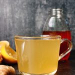ginger mint tea in a clear glass mug