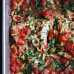 italian baked white fish with tomatoes in baking dish