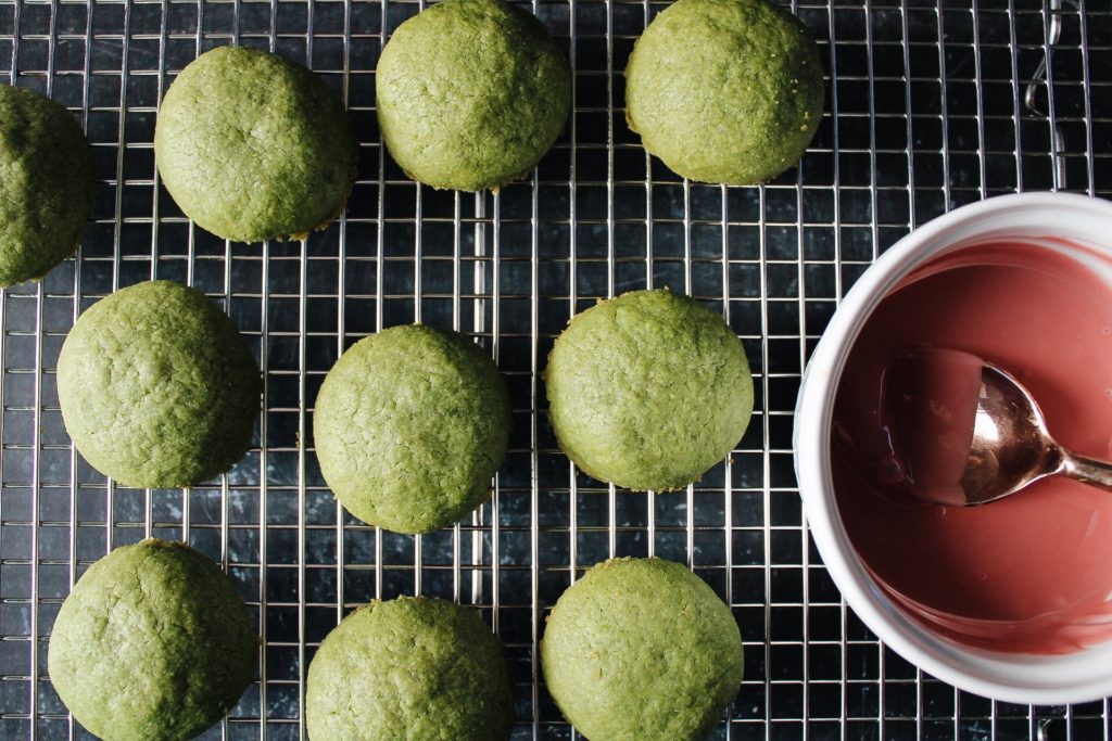 matcha shortbread cookies cooling before ruby chocolate drizzle is added