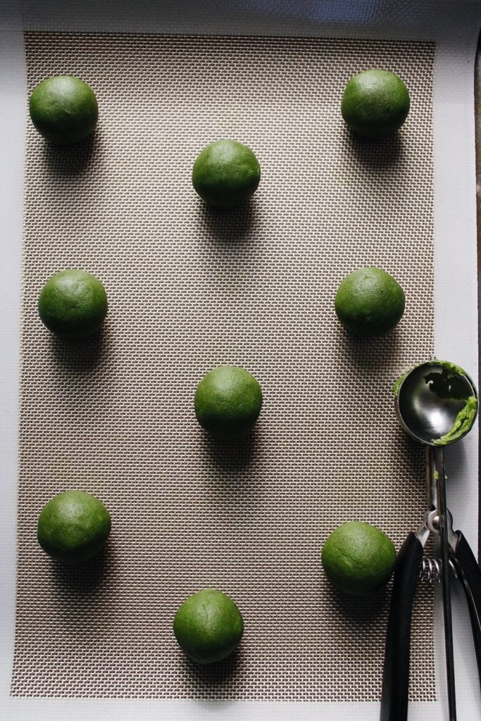 matcha shortbread dough rolled into balls before baking