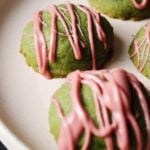 matcha shortbread cookies with ruby chocolate drizzle on a plate