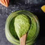 pepita pesto on a wooden spoon