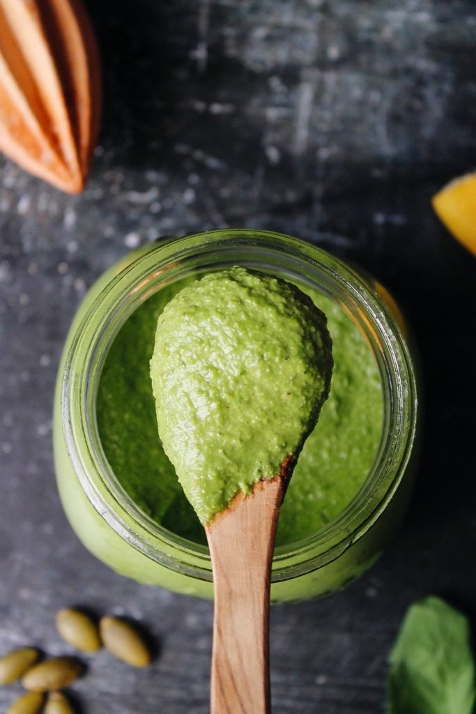 pepita pesto on a wooden spoon