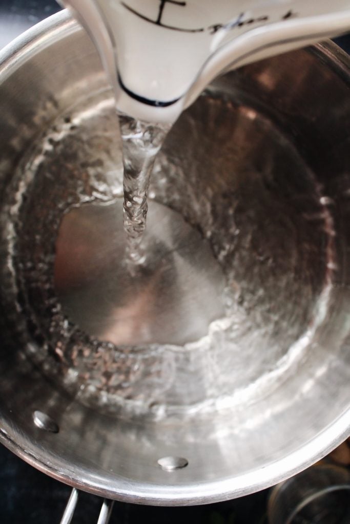 water being poured into a pot