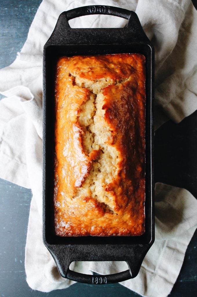 banana bread sweetened with honey in a cast iron loaf pan