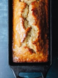 honey banana bread in a cast iron loaf pan