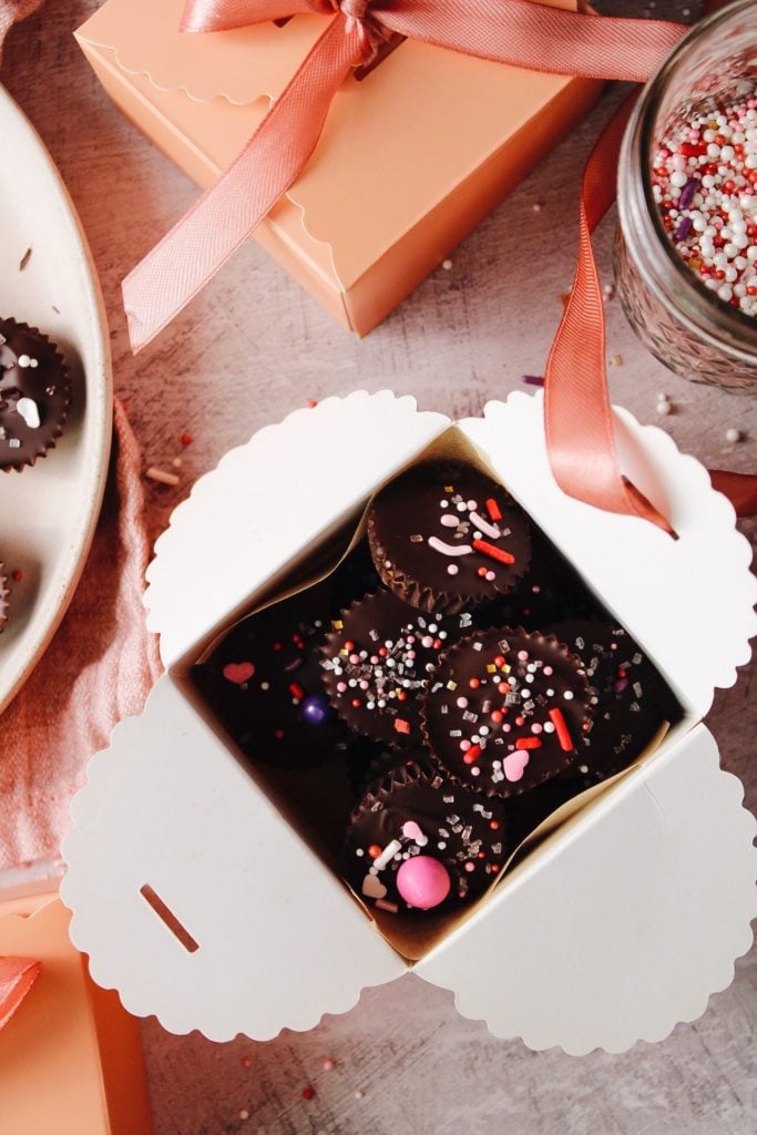 mini homemade peanut butter cups in a pink box for valentines