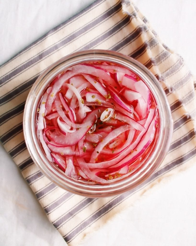 homemade pickled onions in a glass jar