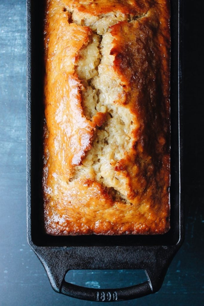 honey banana bread in a cast iron loaf pan