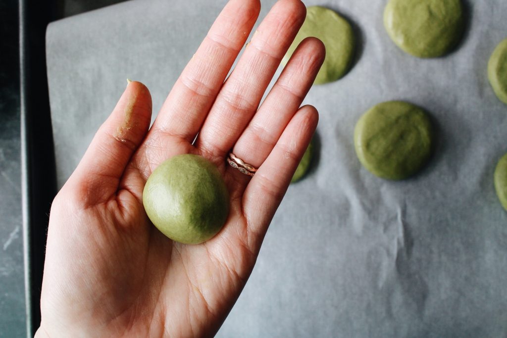 matcha cream center rolled into a ball in somone's hands