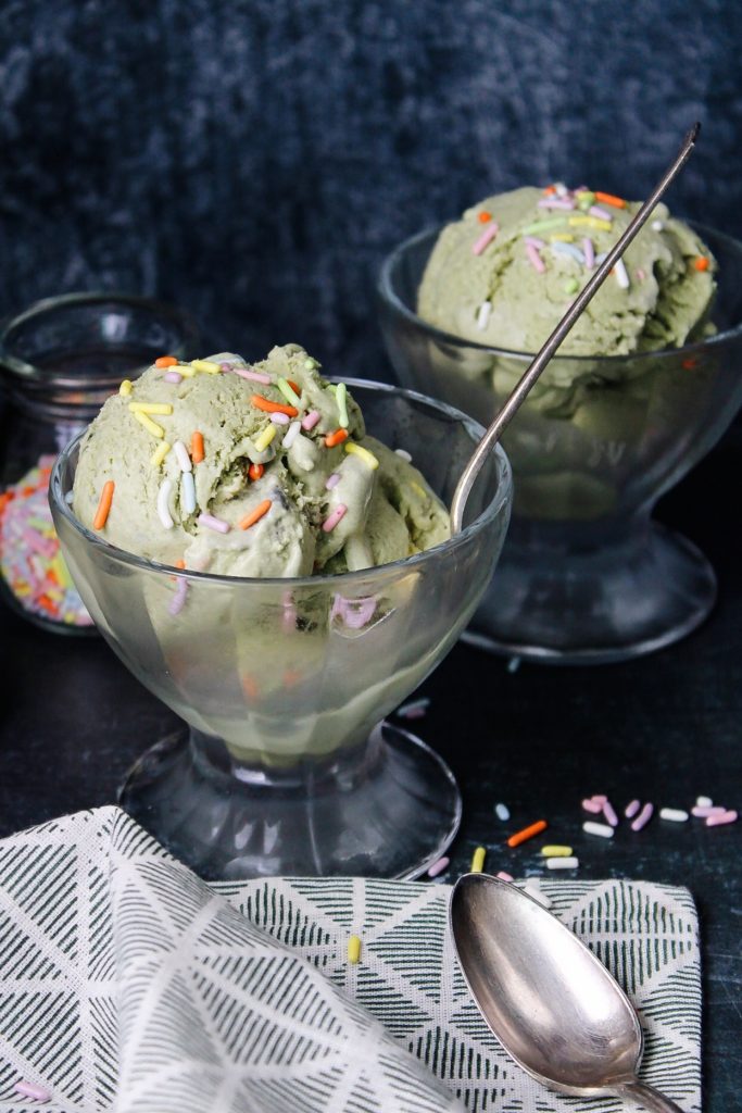 no-churn matcha ice cream in glass dishes topped with sprinkles