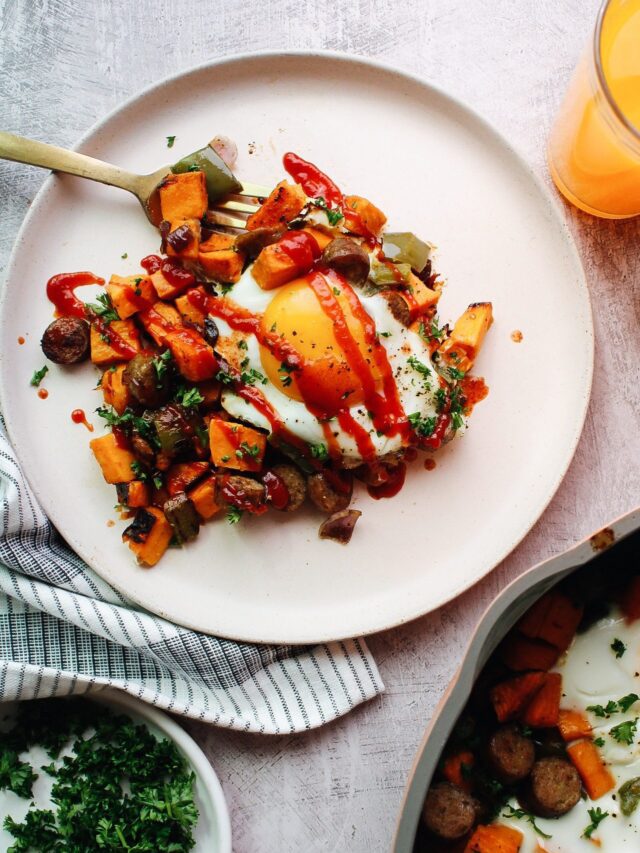 breakfast sweet potato hash topped with ketchup and hot sauce
