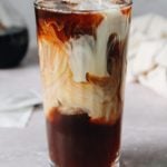 iced dirty chai in a clear glass