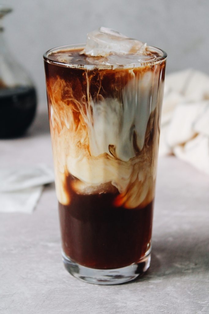 iced dirty chai latte with swirly milk inside