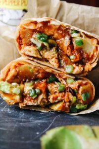 bbq chicken burritos cut in half and stacked.