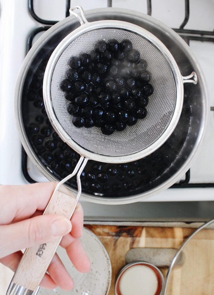 boba pearls being strained after being boiled