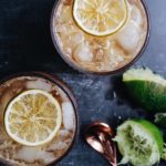 chai lime fizzy drink in clear glasses garnished with a candied lime slice