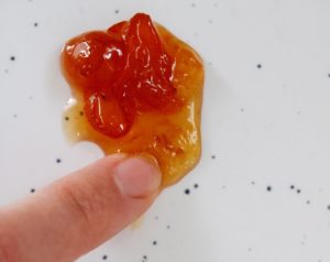 jam that has reached the gel stage as demonstrated by being gently pushed with a finger
