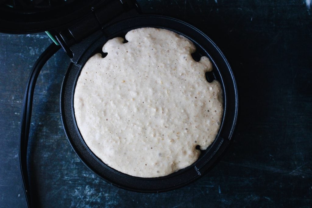 waffle batter in heated waffle iron